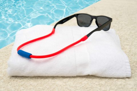 Flotez eyeglass strap on sunglasses at the pool